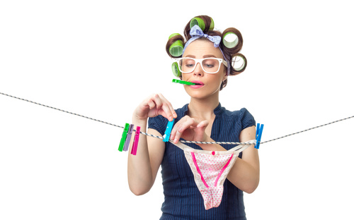 Housewife dry the clothes Stock Photo