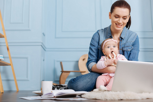 Housewife holding a child online Stock Photo 01