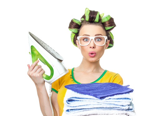 Housewife holding electric iron Stock Photo