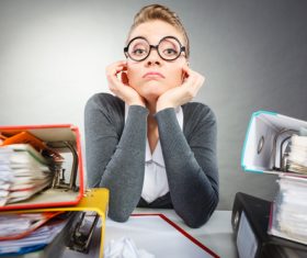 In her secretarys desk in a daze Stock Photo 01