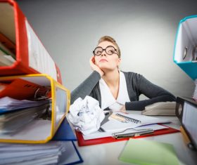 In her secretarys desk in a daze Stock Photo 02