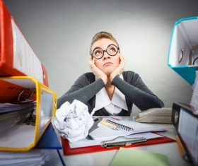 In her secretarys desk in a daze Stock Photo 03