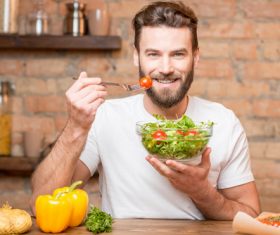 Man eating vegetable salad Stock Photo 01