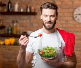 Man eating vegetable salad Stock Photo 02