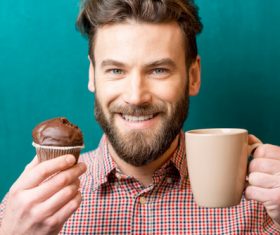 Man holding coffee and cake Stock Photo