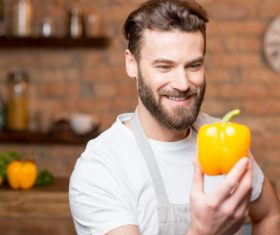 Man holding colorful pepper Stock Photo