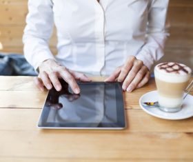 Man in cafe Uses tablets pc Stock Photo