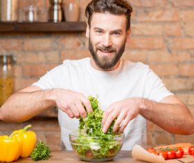 Man making vegetable salad Stock Photo 01