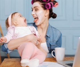 Mother teasing child laughing Stock Photo