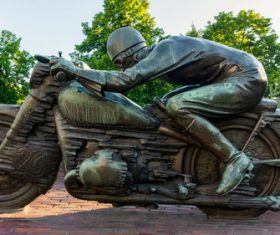 Motorcycle driver bronze statue Stock Photo