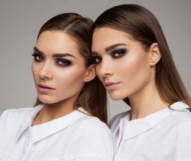 Painted black eyeshadows Beautiful fashion sisters Stock Photo 01