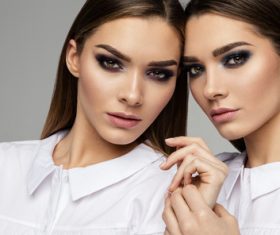 Painted black eyeshadows Beautiful fashion sisters Stock Photo 03