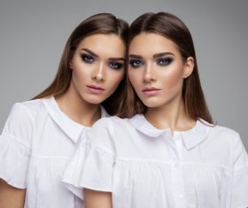 Painted black eyeshadows Beautiful fashion sisters Stock Photo 06