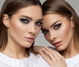 Painted black eyeshadows Beautiful fashion sisters Stock Photo 08