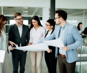 People looking at design drawings Stock Photo