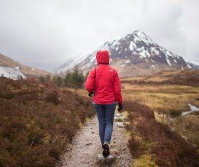 People walking on country road Stock Photo