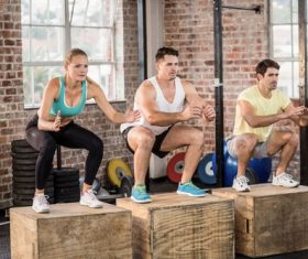 People who do Squat movement Stock Photo
