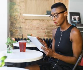 Short hair woman in cafe Uses tablets pc Stock Photo