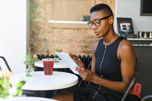 Short hair woman in cafe Uses tablets pc Stock Photo