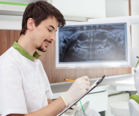 Smiling male dentist Stock Photo