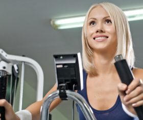 Smiling woman exercising Stock Photo