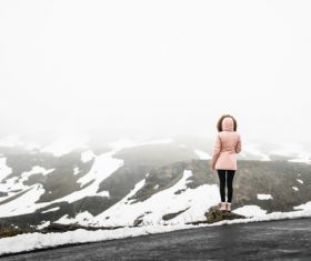 Standing on the top of the mountain watching the beautiful scenery Stock Photo