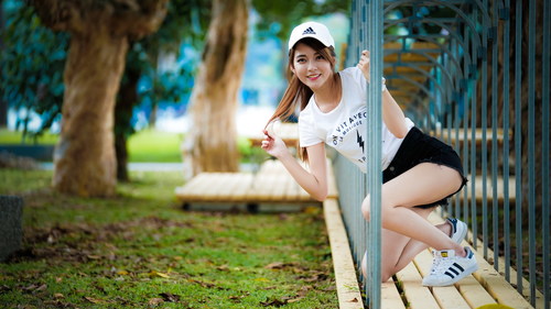 Stock Photo Asian beautiful girl posing in the fence