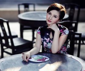 Stock Photo Beautiful cheongsam beauty in Chinese tea house