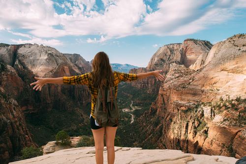 Stock Photo Beauty photography with open arms looking at the scenery