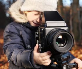 Stock Photo Children playing with the camera