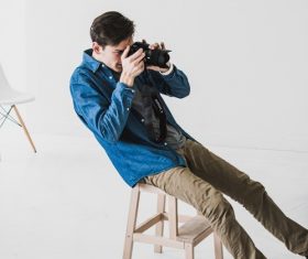 Stock Photo Male photographer at work