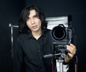 Stock Photo Male photographer in the studio