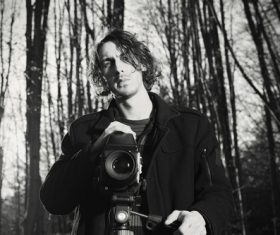 Stock Photo Male photographer in the woods