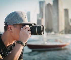 Stock Photo Man photographing city landscape