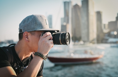Stock Photo Man photographing city landscape