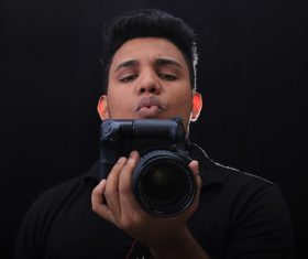 Stock Photo Man with camera in hand