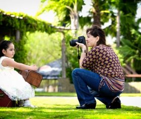 Stock Photo Mother takes photos of her baby