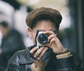 Stock Photo People taking photos on the street
