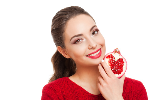 Stock Photo Woman holding pomegranate 01