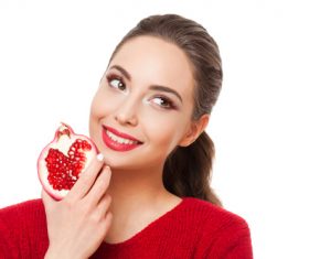 Stock Photo Woman holding pomegranate 02