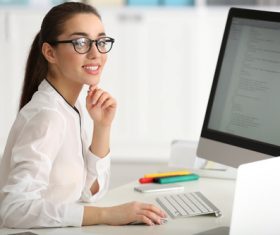 Stock Photo Young female programmer working in the office 02