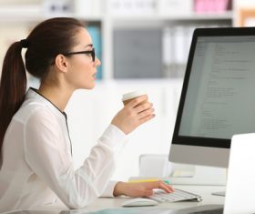 Stock Photo Young female programmer working in the office 04