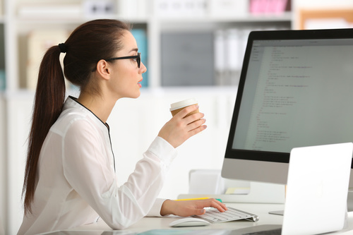 Stock Photo Young female programmer working in the office 04