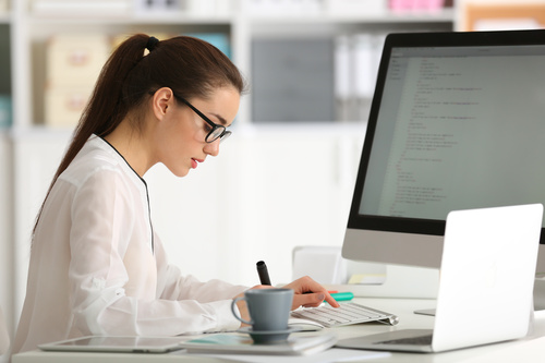 Stock Photo Young female programmer working in the office 05
