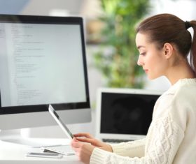 Stock Photo Young female programmer working in the office 10
