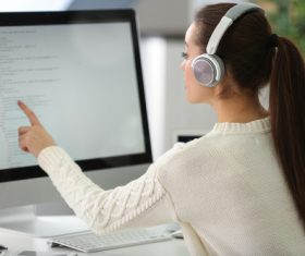 Stock Photo Young female programmer working in the office 11