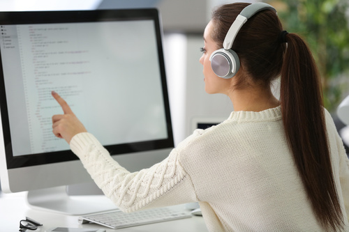 Stock Photo Young female programmer working in the office 11
