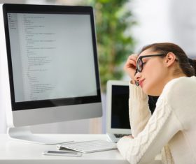Stock Photo Young female programmer working in the office 12