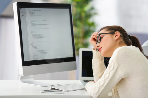 Stock Photo Young female programmer working in the office 12