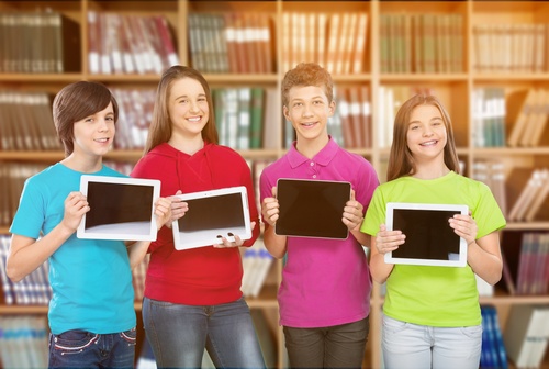 Students holding tablet pc Stock Photo